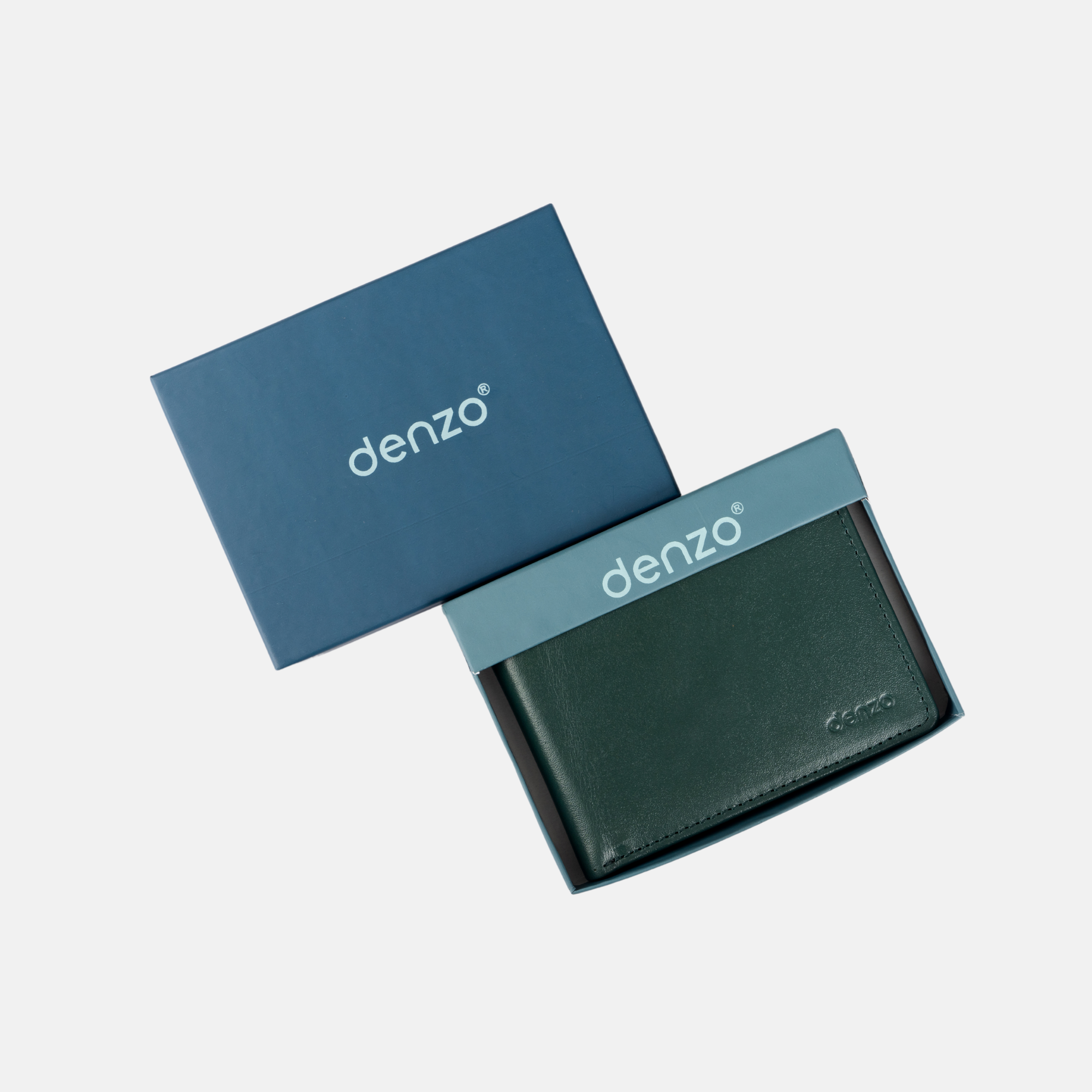 A Vintage Legacy Wallet made of expert-crafted black leather and featuring a timeless design lay partially revealed, sliding out of a blue box labeled with the Denzo Fashion brand name on both the wallet and the box lid, all set against a light gray background.