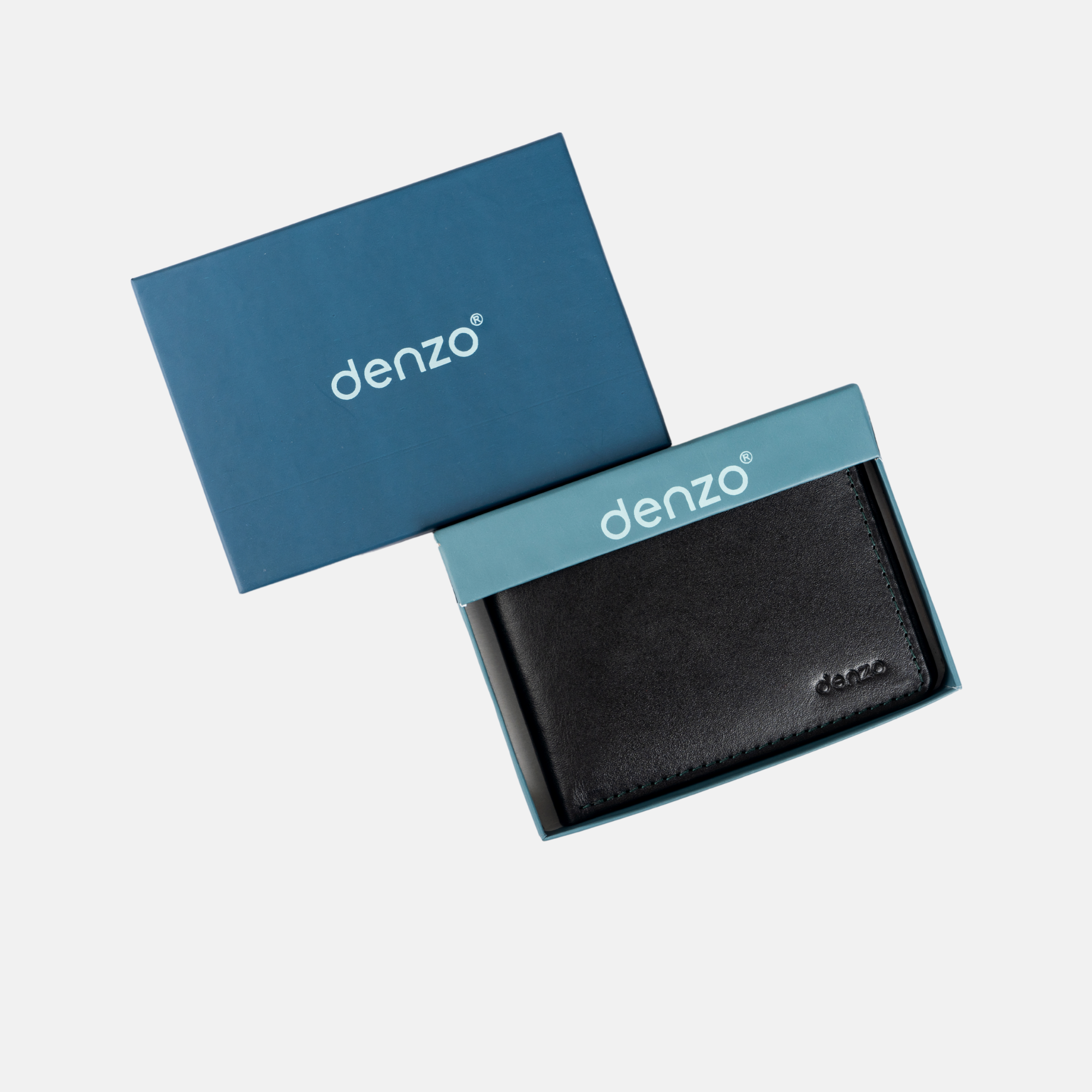 The Vintage Legacy Wallet, skillfully crafted with precision, is presented in a sophisticated blue box. The stylish black wallet and the box lid both prominently display the Denzo Fashion brand name. Set against a simple white background, the open box highlights its classic design.