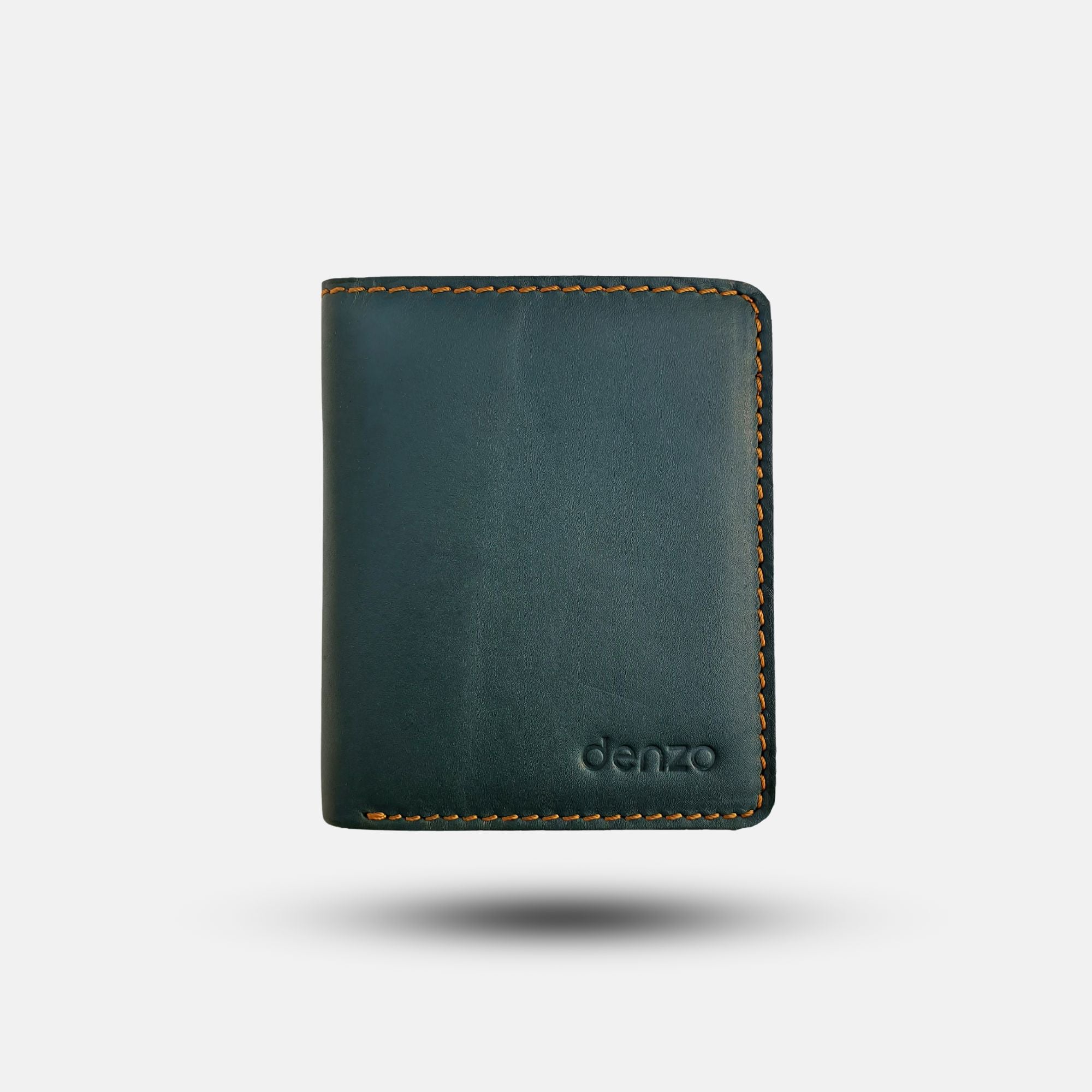 A Timeless Green Bi-Fold Leather Wallet with RFID Protection, featuring yellow stitching and embossed with "Denzo Fashion" in the lower right corner, is centered against a plain white background. The premium leather wallet appears upright and slightly elevated.